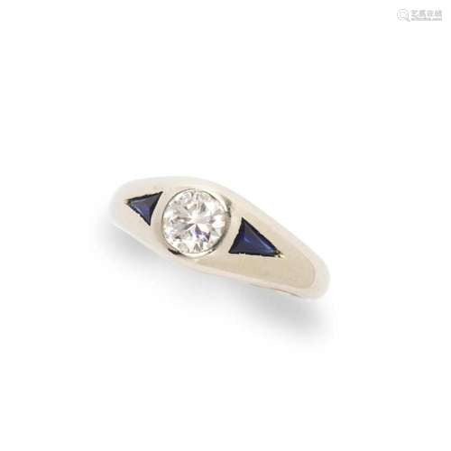 A diamond, sapphire and eighteen karat white gold ring