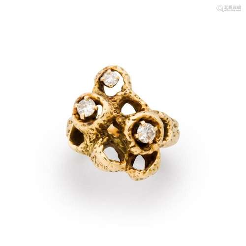 A diamond and fourteen karat gold ring