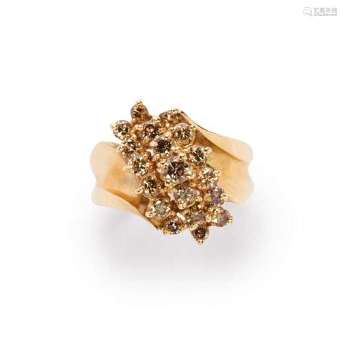 A champagne diamond and fourteen karat gold ring