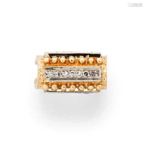 A diamond and fourteen karat bi-color gold ring