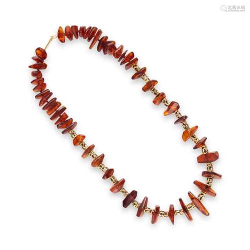 An amber and fourteen karat gold necklace