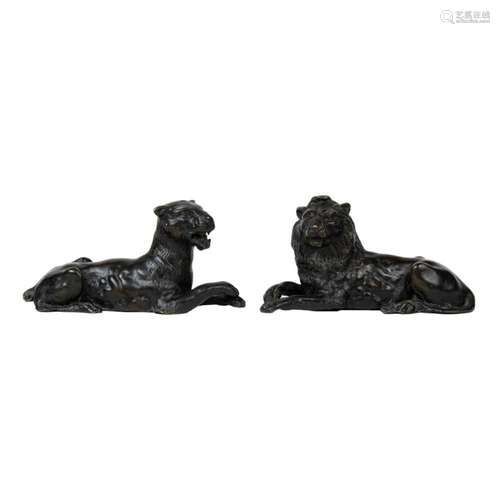 A pair of Continental patinated bronze studies of a lion and...