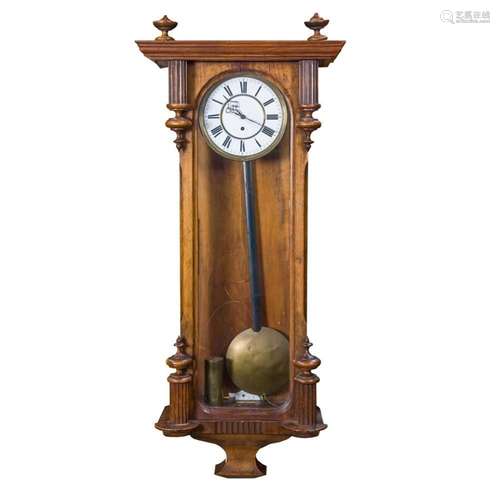 A walnut regulator wall clock