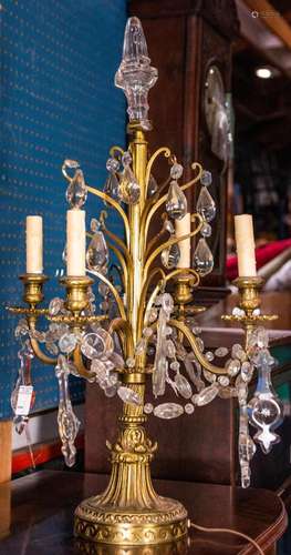 A Louis XV style gilt bronze four-light candelabra fitted fo...