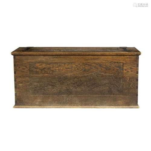 An Arts & Crafts carved oak blanket chest in the Western...