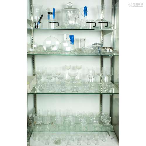 Five shelves of glassware