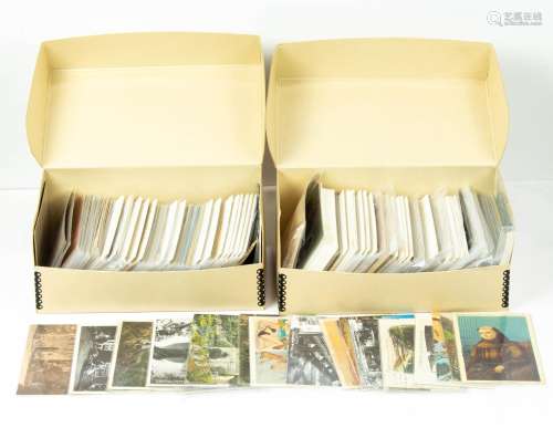 Collection of antique and vintage postcards in two boxes.