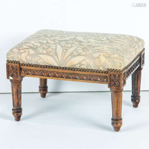 Neoclassical style carved and upholstered footstool