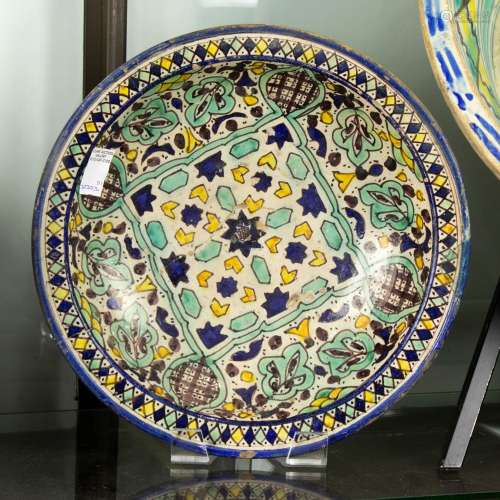 Islamic pottery charger or dish, 18th/19th century, (restore...