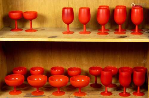 Two shelves of art glass stemware, including small goblets a...