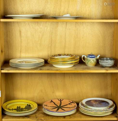 Three shelves of assorted tableware including lustreware pla...