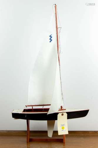 Hand built scale model of a sailboat on stand