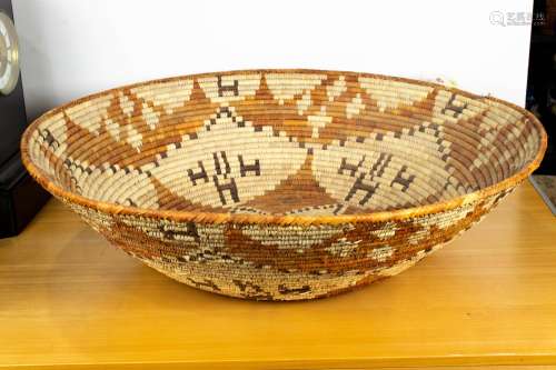 Large ethnographic woven basket, 30.25