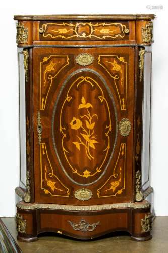 A Louis XV style marquetry decorated cabinet, the case of bo...