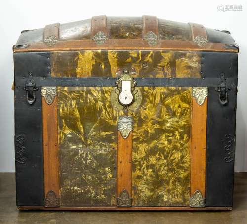 A Victorian dome form trunk with gilt paint and oak supports
