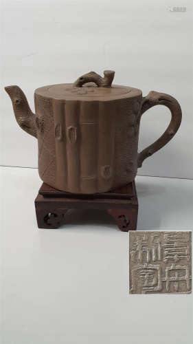 old. Purple clay teapot.