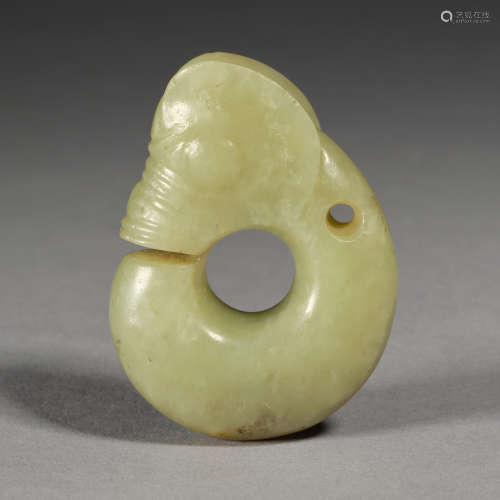 An important celadon and russet jade 'pig-dragon', zhulong N...