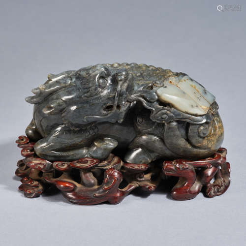 A jade carving of 'auspicious qilin spits out jade book' ,Qi...