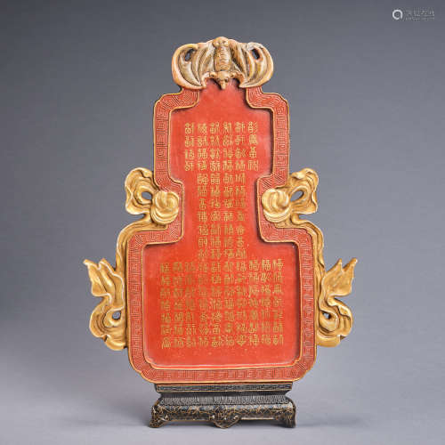 A gilt-decorated coral-red glazed porcelain hanging wall pla...