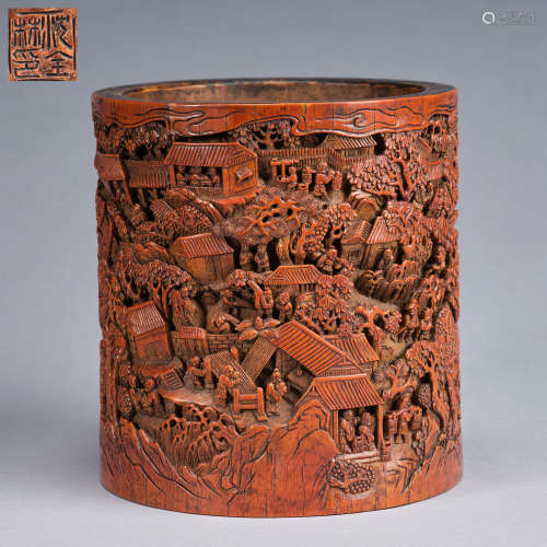 A finely carved 'landscape' bamboo brushpot, Qing dynasty