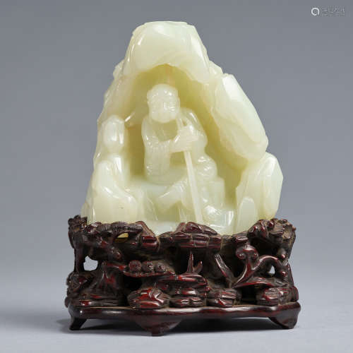 A jade 'arhat' mountain with wood stand,Qing dynasty