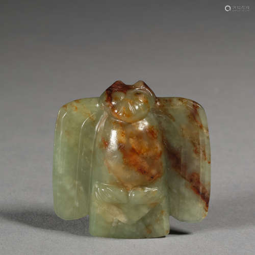 A superbly carved celadon jade bird-shaped pendant Neolithic...