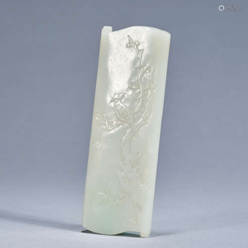 A carved jade 'magpie and prunus' imperial wristrest, Qing d...