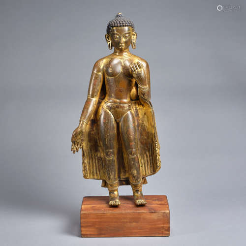 A gilt-copper alloy figure of staning Buddha Tibet,Qing dyna...