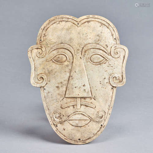 A calcified celadon jade 'face' ,Han dynasty