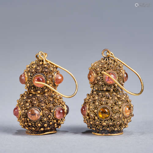 A pair of reticulated gilded silver 'gourd-shaped' ear rings...