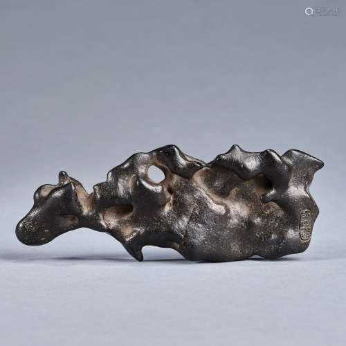A 'cattle-shaped Taihu stone' brush rest, Qing dynasty