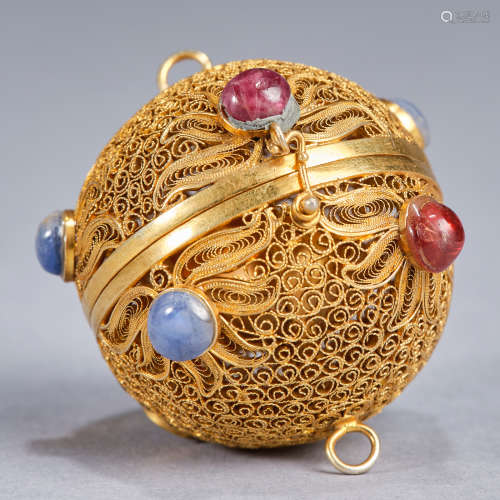 A small reticulated gilded silver spherical 'floral' incense...