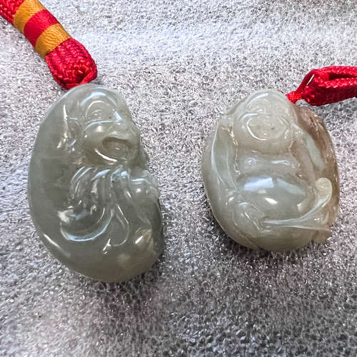 LOT OF 2, CARVED JADE PENDANTS OF SMILING BUDDHA