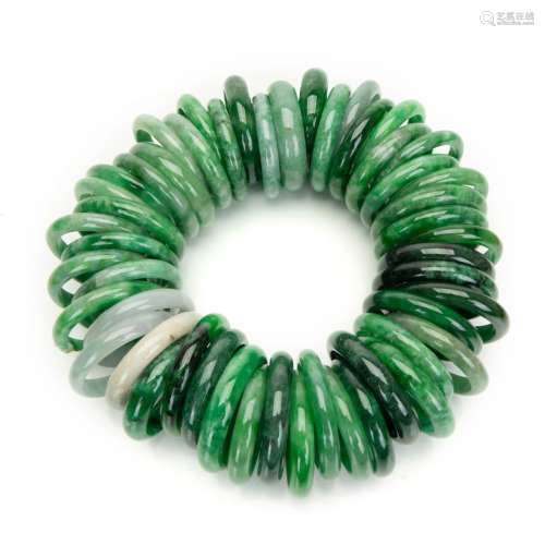 GROUP OF FIFTY JADE / VARIED STONE BANGLE