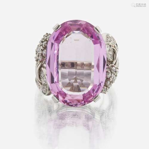 An 18K white gold, pink topaz, and diamond ring