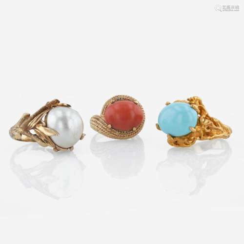 A collection of three 14K yellow gold and gem-set rings