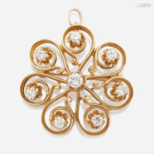 A 14K yellow gold and diamond pendant/brooch