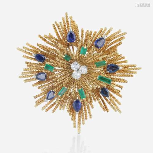 An 18K yellow gold, sapphire, diamond, and emerald starburst...