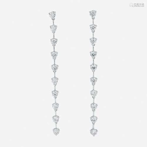 A pair of 18K white gold and diamond dangle earrings