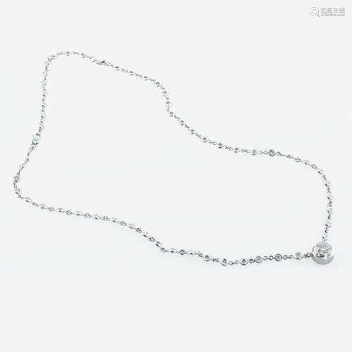 A 14K, white gold diamond bezel set necklace