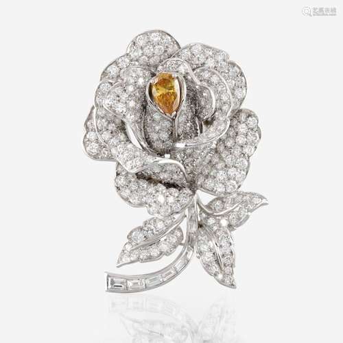 A diamond, yellow diamond, and platinum rose brooch