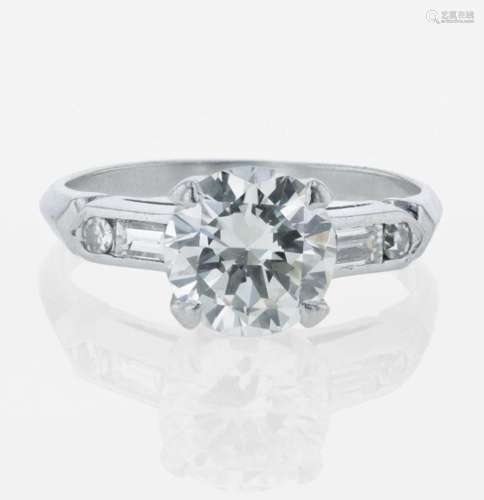 A diamond and platinum solitaire ring