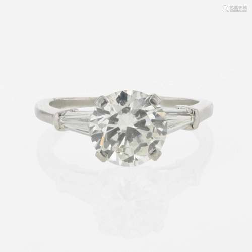 A diamond accented solitaire ring