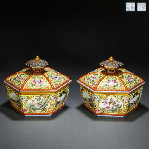 A pair of enamel flower and bird lidded boxes in Qing Dynast...