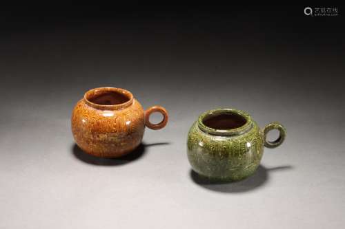 Two Tang Dynasty twisted glaze jars