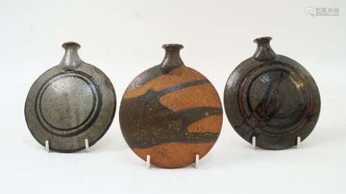Three Japanese studio pottery flasks, two with indistinct ma...