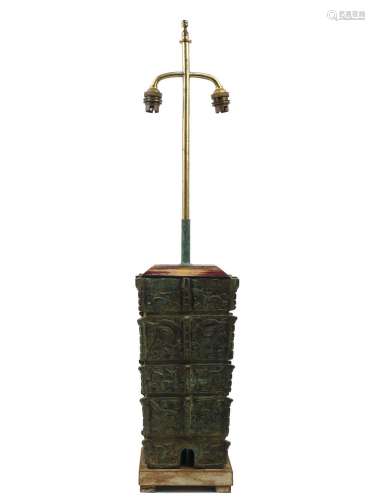 An Archaic Chinese style bronzed table lamp in the manner of...