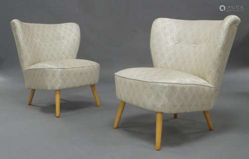 A pair of German cocktail chairs, c.1950, upholstered in Osb...