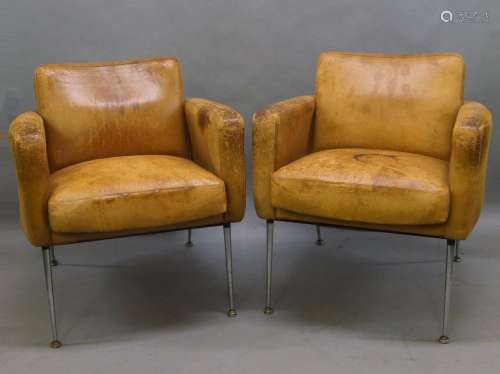A pair of French tan leather armchairs, mid-20th century, ra...