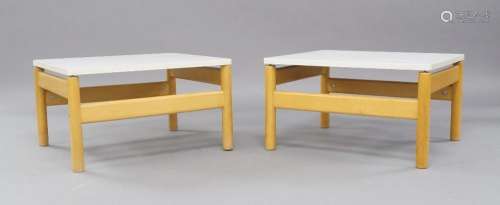 A pair of modern beechwood tables, with white laminate tops,...
